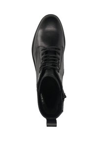 Schwarze Leder-Ankle-Boots mit runder Zehenpartie, Schnürverschluss und einer Zuglasche an der Ferse. Das Innenfutter ist mit einem weichen Material ausgekleidet.