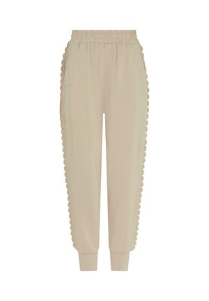Beiget pehmeästä kankaasta valmistetut joggers-housut, joissa on siksakreunainen sivusomiste. Venyvä vyötärönauha ja resorit lahkeensuissa rentoa istuvuutta varten.