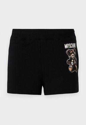 Black cotton shorts featuring a graphic of a bear with colorful patches. The waistband is elastic for comfort and a casual fit.