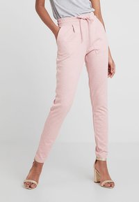 Zachte joggers in een bleekroze tint, met een hoge tailleband en een koord, slim fit en zijzakken.