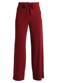 Rode wijde broekspijpen van zacht materiaal, met een strik aan de voorkant van de taille, een gladde textuur en zonder zakken. Ideaal voor casual dragen.