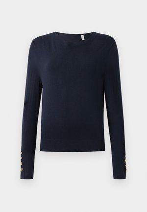 Suéter de punto azul marino, de manga larga, con un escote redondo y detalles de botones en los puños. Textura suave y diseño ajustado.