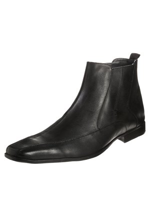 Black leather ankle boot with pointed toe, side elastic panel, and low heel, shown against a white background.