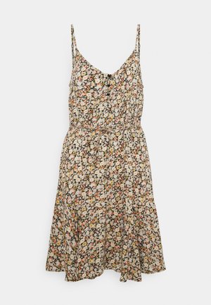 Sukienka w kwiaty na cienkich ramiączkach z taliowaniem. Posiada czarne tło, rozproszone białe, różowe i żółte kwiatowe wzory oraz rozkloszowaną spódnicę.