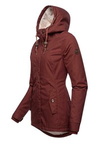 Maroon jacket with hood, featuring a fleece lining, snap buttons, and drawstring adjusters. Includes two side pockets and a logo patch.