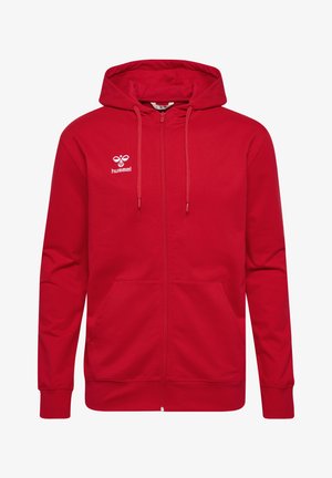 Rød zip-up hoodie lavet af bomuldsblanding med en kengurulomme, justerbar snoretræk i hætten og hvidt logo øverst til venstre på brystet.