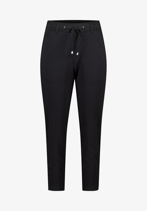Pantalons noirs, fuselés, en tissu lisse avec un élastique à la taille, une fermeture à cordon et des poches latérales. Présente des accents argentés.