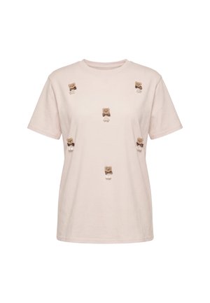 Beige kortærmet T-shirt med små broderede bamser med sløjfer, jævnt fordelt på forsiden. Ingen synlig baggrund.