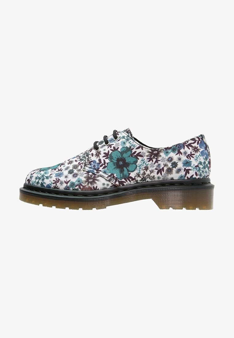 Chaussure à lacets à talon bas avec semelle translucide et empeigne blanche avec imprimé floral turquoise et violet.
