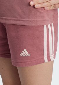 adidas Performance ESSENTIALS 3-STRIPES - Sports shorts - preloved crimson sandy pink