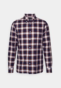Camicia a maniche lunghe a quadri nei colori blu navy, bianco e ruggine. Collo button-down, bottoni bianchi e piccolo logo sul petto. Materiale in cotone.