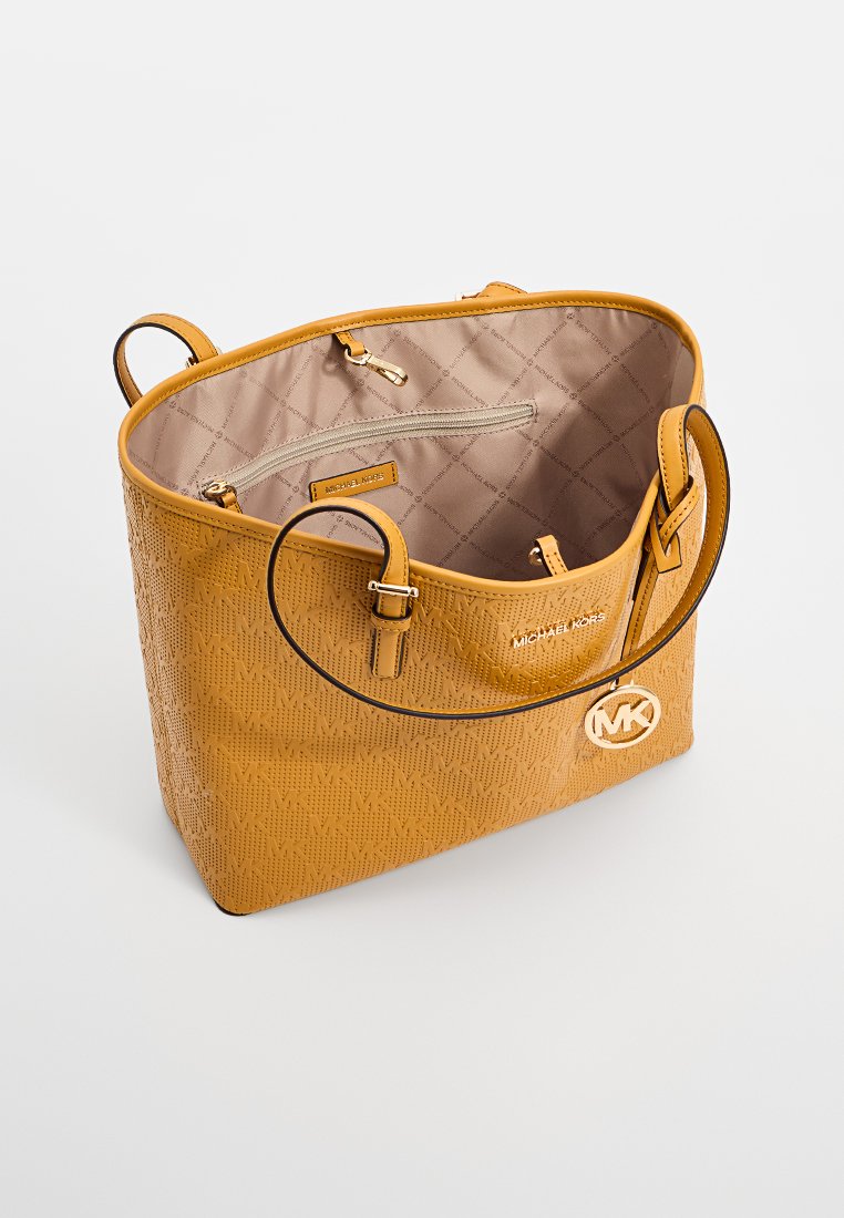 Gelbe Leder-Shopper-Tasche mit Rautenmuster, doppelten Tragegriffen und Michael Kors-Logo. Das Innere verfügt über ein gestepptes Futter und eine Reißverschlusstasche.