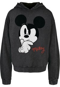 Felpa nera con cappuccio con una grafica di un topo dei cartoni animati con grandi orecchie, mani sul mento e il nome "Mickey" in corsivo rosso. Tessuto morbido.