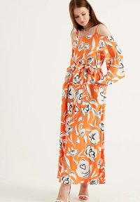 Herita Maxikjoler - orange