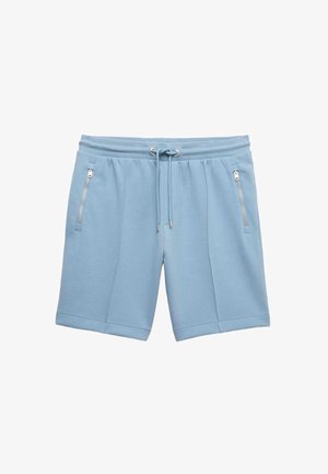 Light blue shorts made of soft fabric, featuring a drawstring waist and two zippered side pockets, with stitched detailing on the legs.