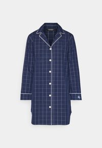 Pajama majica u tamnoplavom kariranom uzorku s bijelim rešetkastim uzorkom, s dugim rukavima, klasičnim ovratnikom i gumbima sprijeda, uz bijeli obrub duž ovratnika i rukava.