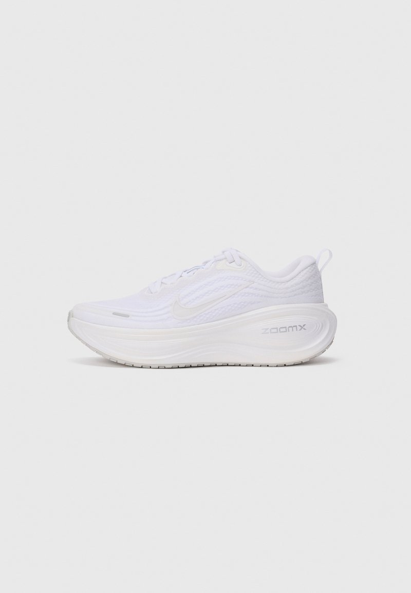 White athletic shoe with a textured upper, rounded shape, and ZoomX cushioning logo on the side. Features a lace-up design and pull tab.
