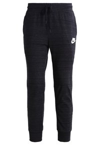 Svarta atletiska joggersbyxor i strukturerad tyg, med elastisk midja och dragsko samt en vit logotypdetalj på höften.