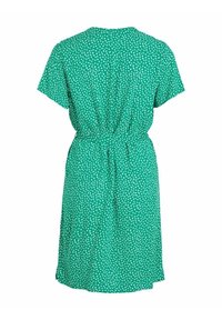 Grön klänning med korta ärmar, åtsittande i midjan. Har ett prickigt mönster och en avslappnad passform, tillverkad av ett lätt tyg.