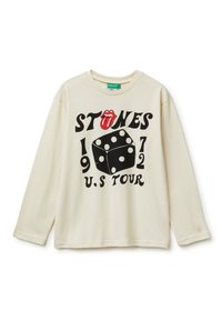 Cremefarbiges Langarm-T-Shirt mit rundem Halsausschnitt. Schriftzug mit einer Grafik von einer Zunge und Würfeln, mit "STONES 1972 U.S. TOUR" in fetter schwarzer Schrift.