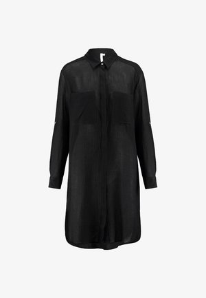 Camicia nera a maniche lunghe realizzata in tessuto leggero. Presenta un colletto, due tasche frontali e una chiusura con bottoni. Superficie testurizzata.