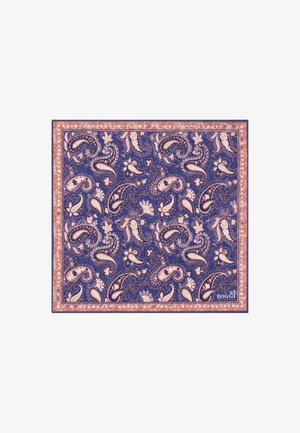 Sininen ja persikanvärinen paisley-kuvioitu neliönmuotoinen nenäliina, jossa on kukkaisia yksityiskohtia ja tuotemerkin kulmalaatta.