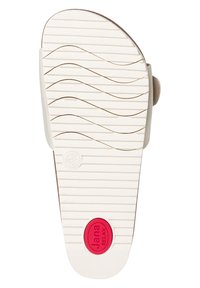 Light beige sandal sole with a textured wave pattern, white accent, and a red circular logo embossed with "Jana RELAX" in the center.