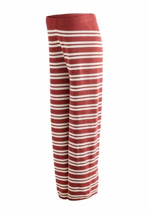 Dzianinowe spodnie o szerokich nogawkach z poziomymi białymi i rdzawo-czerwonymi paskami, z prążkowanym pasem.