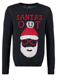 Schwarzer Pullover mit einem gestrickten Santa-Gesicht, rotem Hut und Sonnenbrille; Text "SANTA'S OUT" in Rot darüber, mit gerippten Bündchen und Saum.