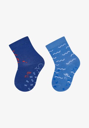 Knee-high socks in dark blue and light blue. The dark blue sock features red accents and patterns; the light blue has white wave patterns.