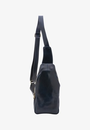 Black leather sling bag with adjustable strap and gold-tone zipper on side, shown upright on white background.