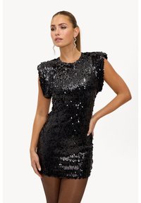 Zwarte mini-jurk met pailletten, een aansluitende pasvorm, korte mouwen en een glanzende textuur. Heeft een ronde halslijn en glinsterende accenten.