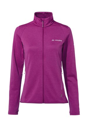 Veste violette pour femme à fermeture éclair intégrale, col montant, manches longues, poches latérales zippées et logo « Vaude » sur la poitrine gauche.
