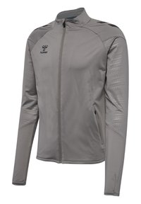 Veste de sport grise avec fermeture éclair intégrale, manches longues, accents texturés sur les épaules et un logo sur la poitrine gauche. Fabriquée en matériau léger.