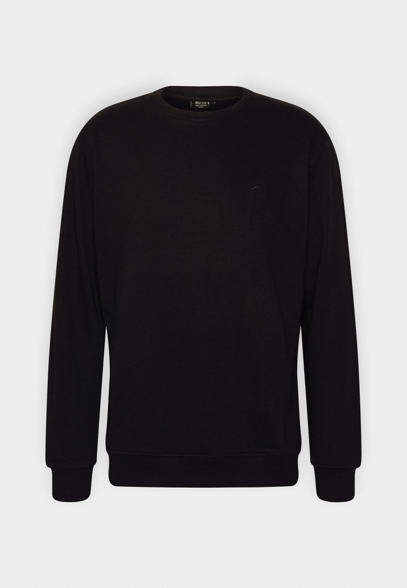 Felpa nera in cotone, con collo rotondo, maniche lunghe e polsini a costine. Dettaglio logo discreto sul petto. Design minimalista.