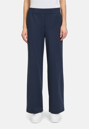 Marineblauwe wijde broek met een zachte stof en een elastische tailleband, voorzien van een voorvak en een gladde textuur.