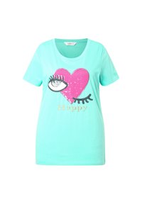 Mintgrøn kortærmet t-shirt med en rosa paillet-hjertegrafik med et øje og ordet "Happy" i guld nedenunder. Blødt bomuldsmateriale.
