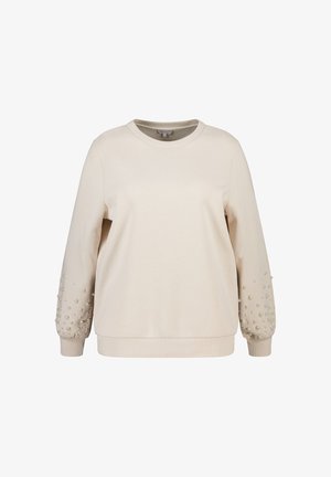 Beige sweatshirt met lange mouwen, ronde hals en textuurdetails. Mouwen zijn versierd met decoratieve kralen in verschillende maten. Zachte stofafwerking.