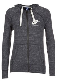 Mörkgrå zip-hoodie med vita dragsnören, framfickor och vit Nike-logga med "Just Do It" slogan på bröstet.