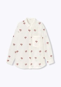 Chemise blanche à boutons avec broderie florale rouge sur l'ensemble, col classique, manches longues et une poche poitrine.