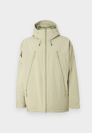 Světle béžová nepromokavá bunda s kapucí. Obsahuje kapsy na zip, přední zipový uzávěr a texturovaný povrch. Jednoduchý design.