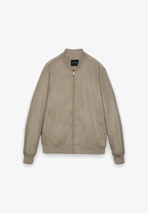 Beige bomber jacket made of soft suede, featuring a zip closure, side pockets, ribbed cuffs, and a round neckline.