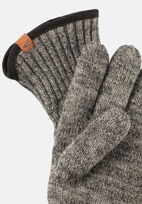 Knitted gloves in gray with a ribbed texture. The cuff features a black trim and a small brown leather tag. Smooth, warm material.