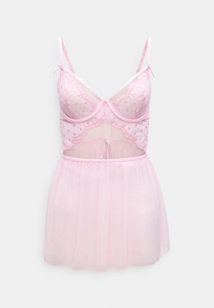 Hellrosa Dessous-Set aus transparentem, gepunktetem Stoff. Besteht aus einem figurbetonten Korsett mit Spitzenverzierung, verstellbaren Trägern und einem ausgestellten Rock.