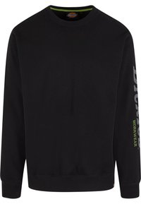 Musta pitkähihainen pyöreäkauluksinen collegepaita, jossa "Dickies Workwear" on painettuna vihreällä ja harmaalla oikeassa hihassa.