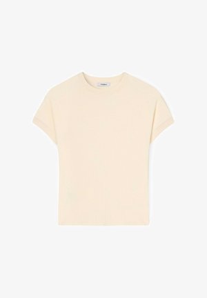 Kremowy, prążkowany top z krótkim rękawem, okrągłym dekoltem i małą metką marki wewnątrz kołnierza.