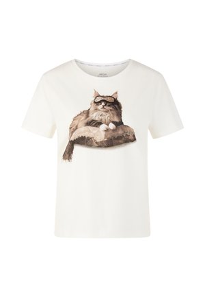 White cotton t-shirt featuring a printed image of a cat with glasses lounging on a patterned cushion. Short sleeves and crew neck design.