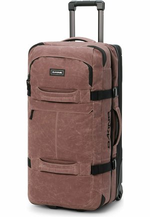 Bruine zachte koffer op wieltjes met uitschuifbare handgreep, twee voorvakken, zijhandgrepen en zwart Dakine-logo.