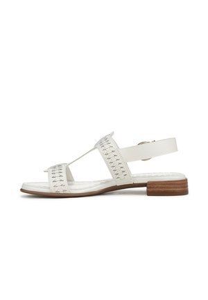White sandal with woven detailing, open toe, and back strap. Low, block wooden heel. Smooth surface with a flat sole.