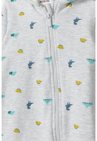 Gray zip-up onesie featuring a pattern of colorful dinosaur and bird images in blue, yellow, and green on soft fabric.